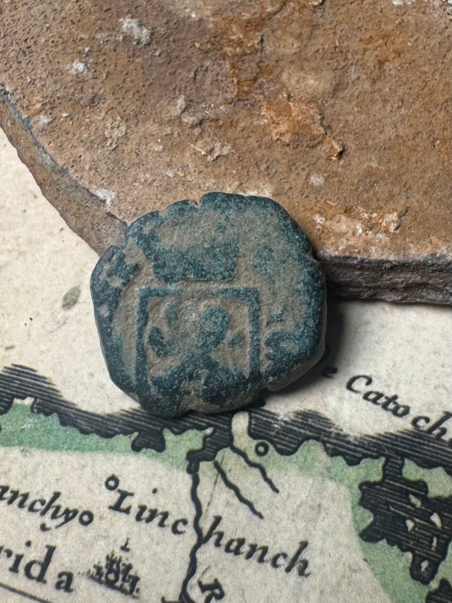 Spanish maravedis with a boxed countermark and deep green patina