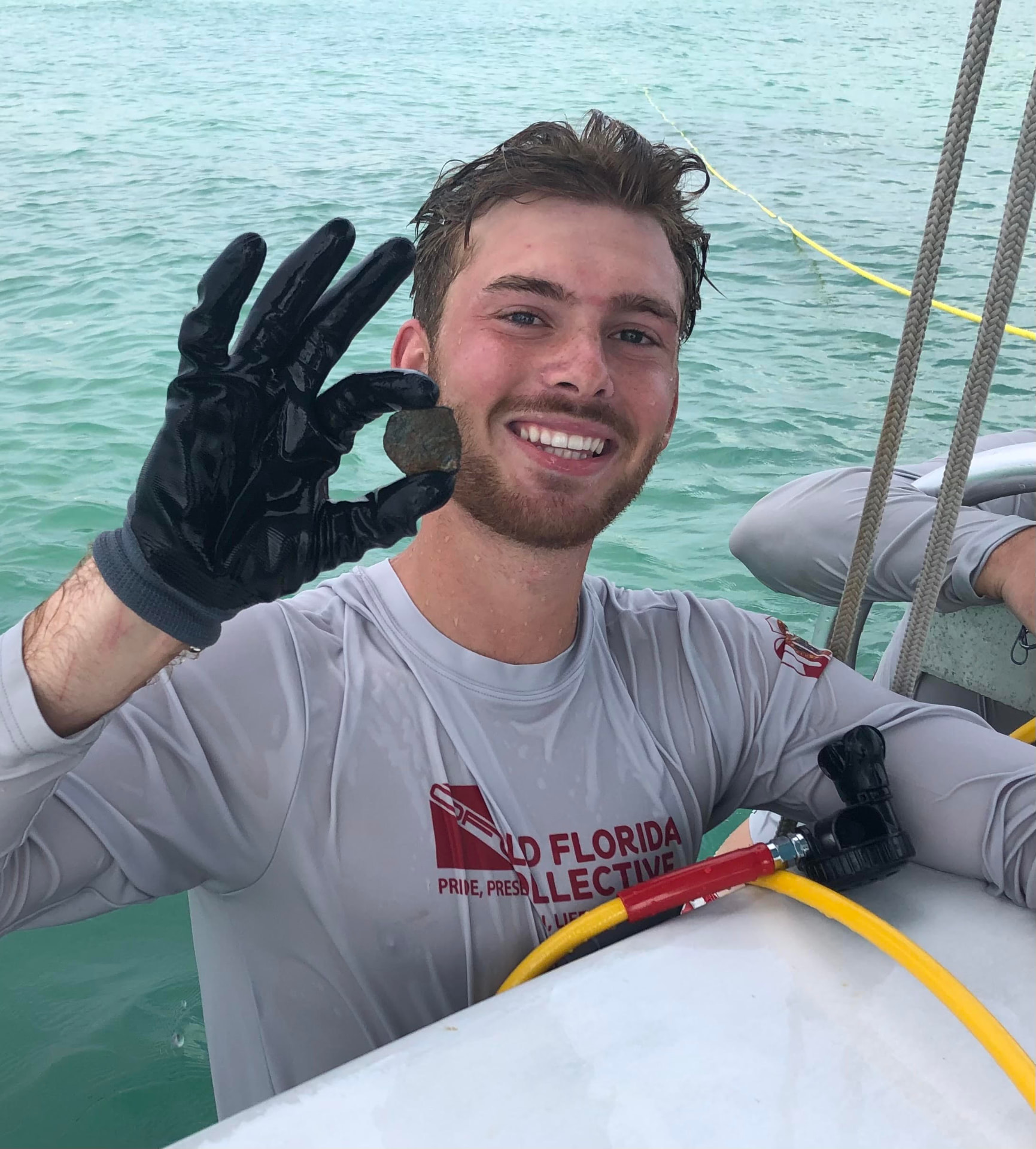 Founder Nick Amelio holding a recovered artifact at a 1715 Fleet wreck site