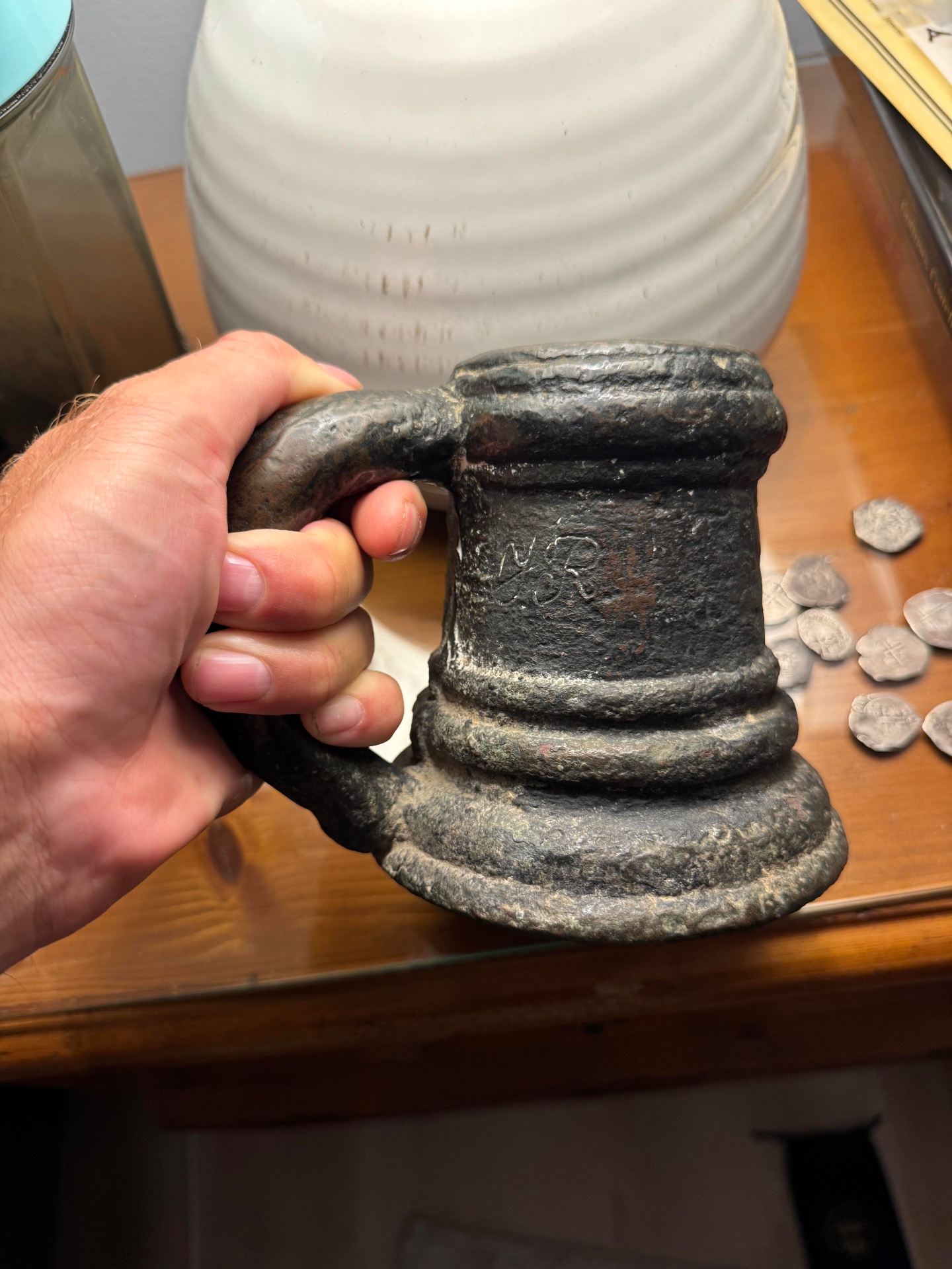 Bronze thunder mug hand cannon held by its thick handle