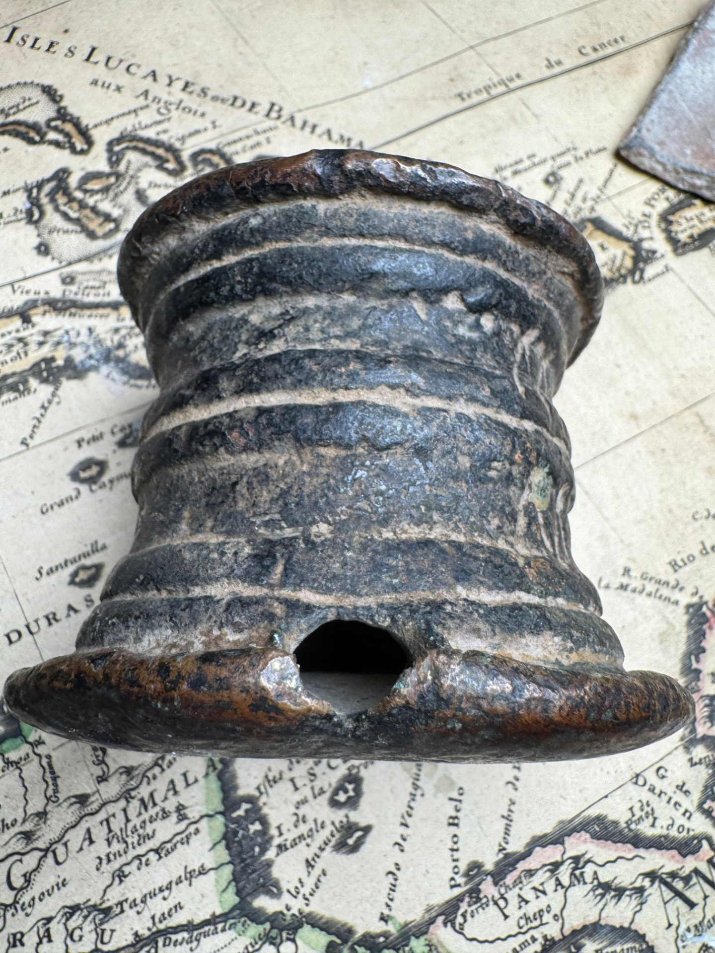 Rear view of the inscribed bronze thunder mug showing the vent opening