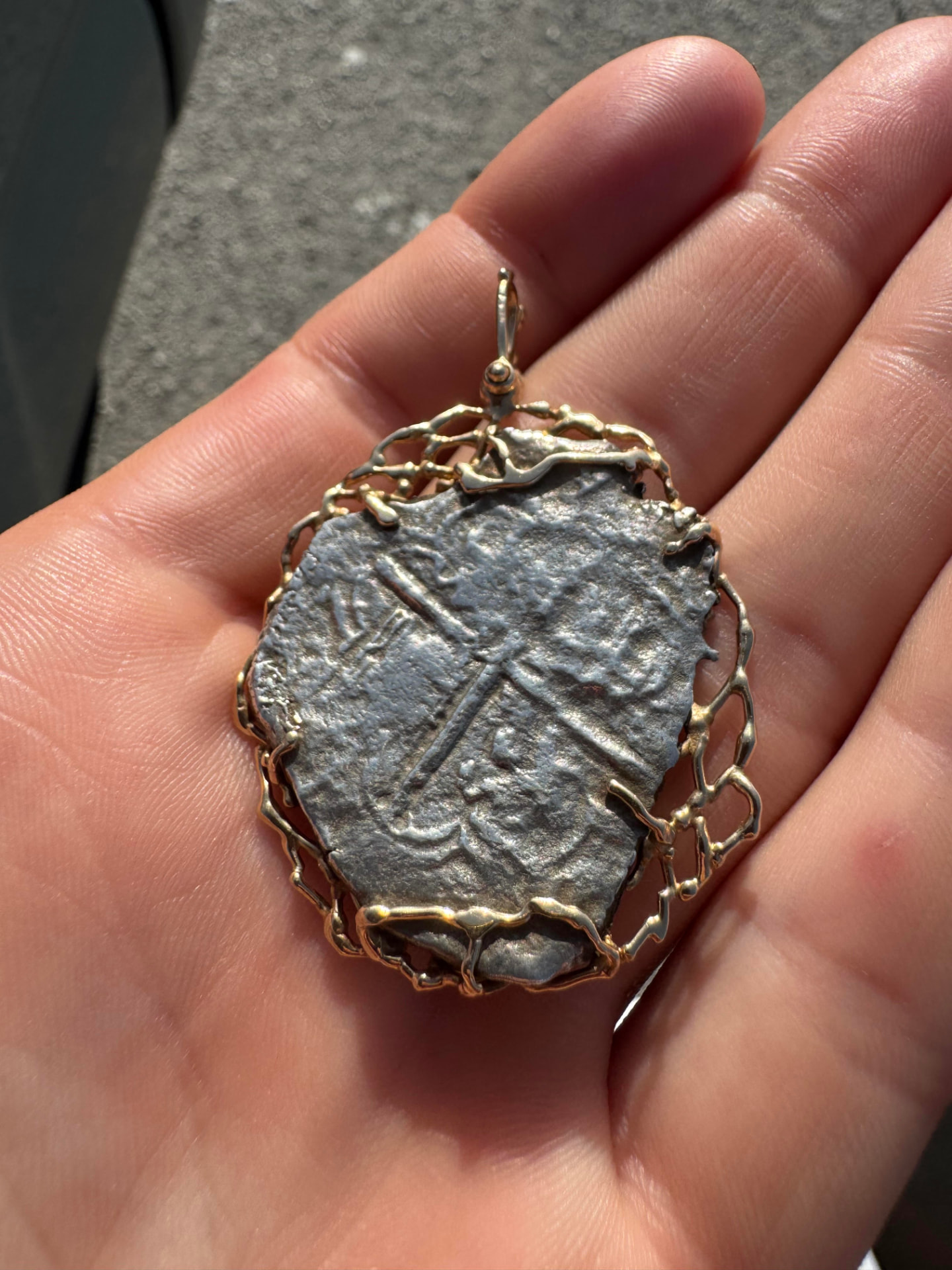 Atocha 8 reales cob set in a gold wrapped pendant