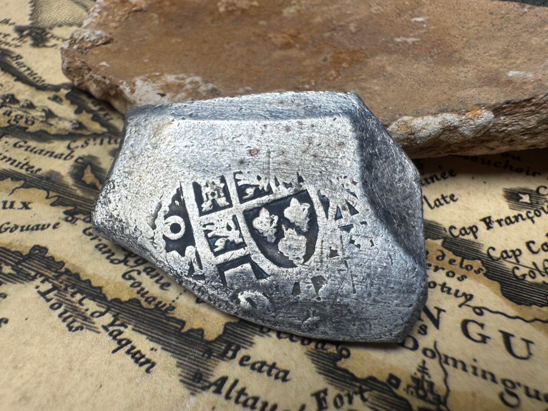 Shield side of the 1715 Fleet Mexico 8 reales silver cob