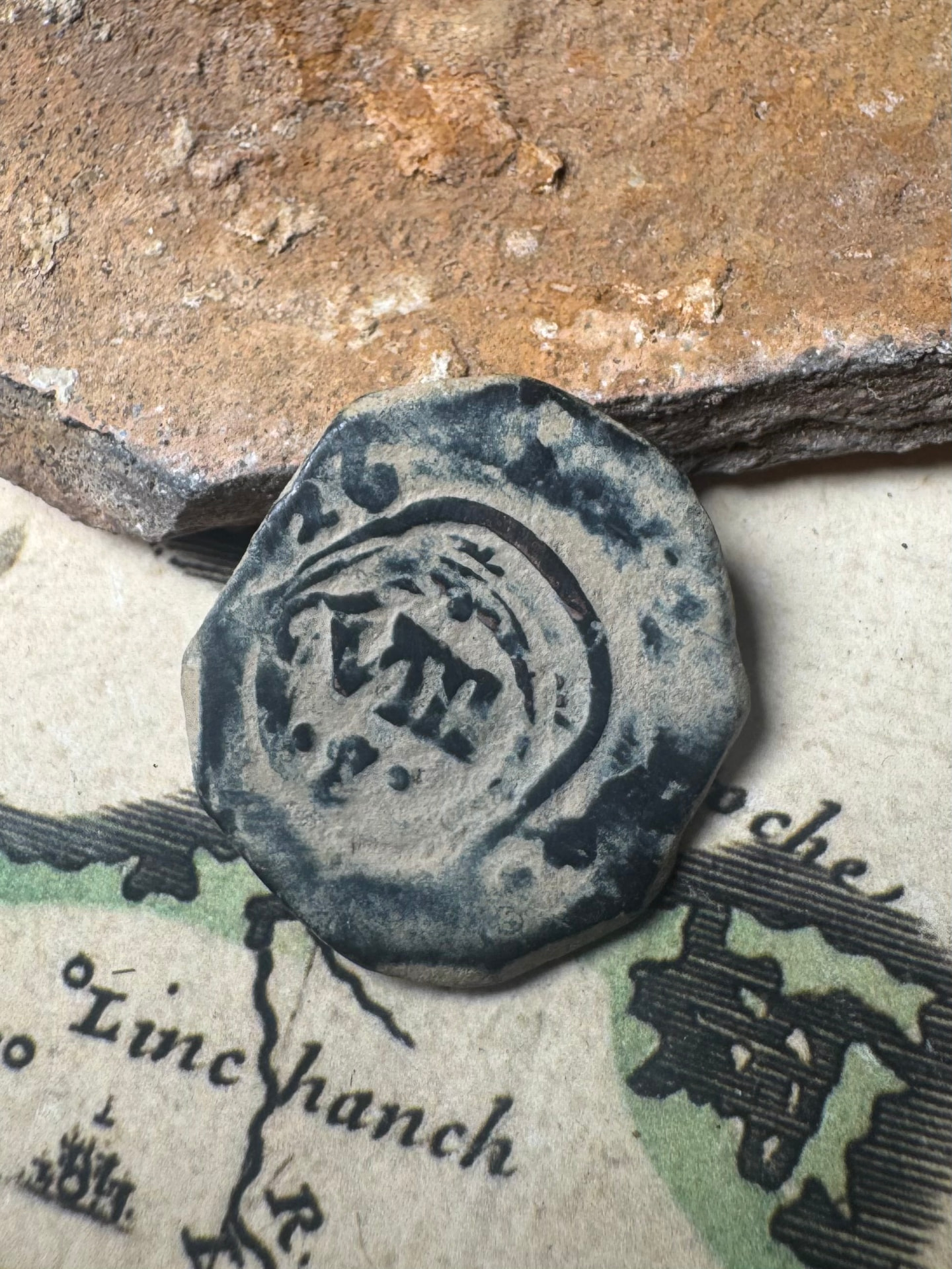 Spanish maravedis bearing a crowned countermark on an antique chart