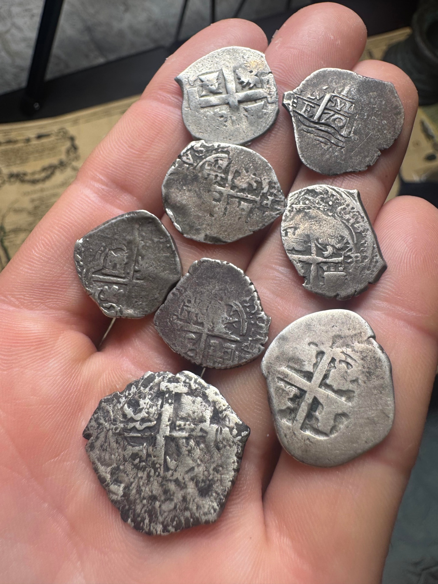 Handful of Spanish colonial 1 reale silver cobs