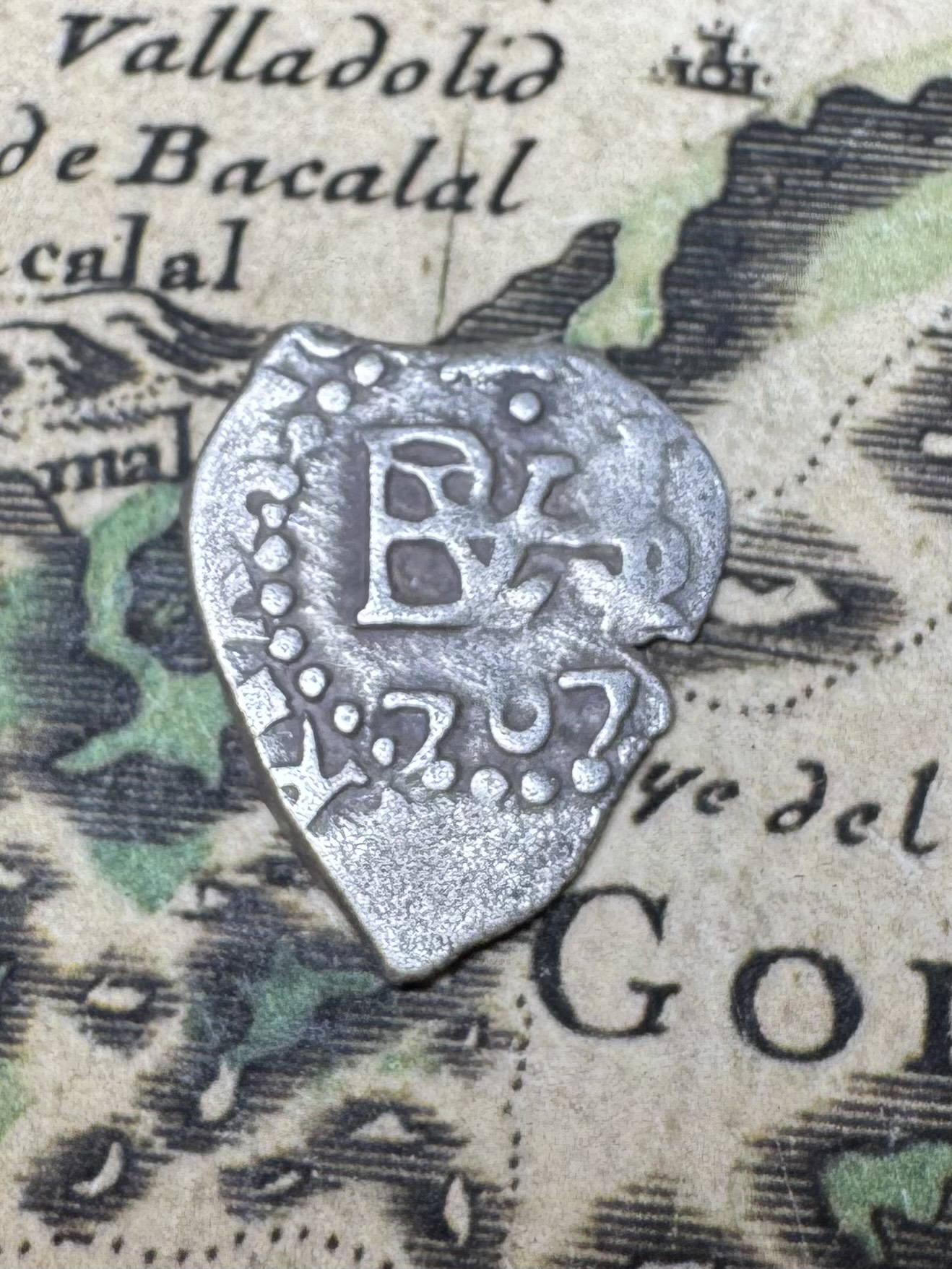 Spanish colonial 1/2 reale silver cob showing the shield side