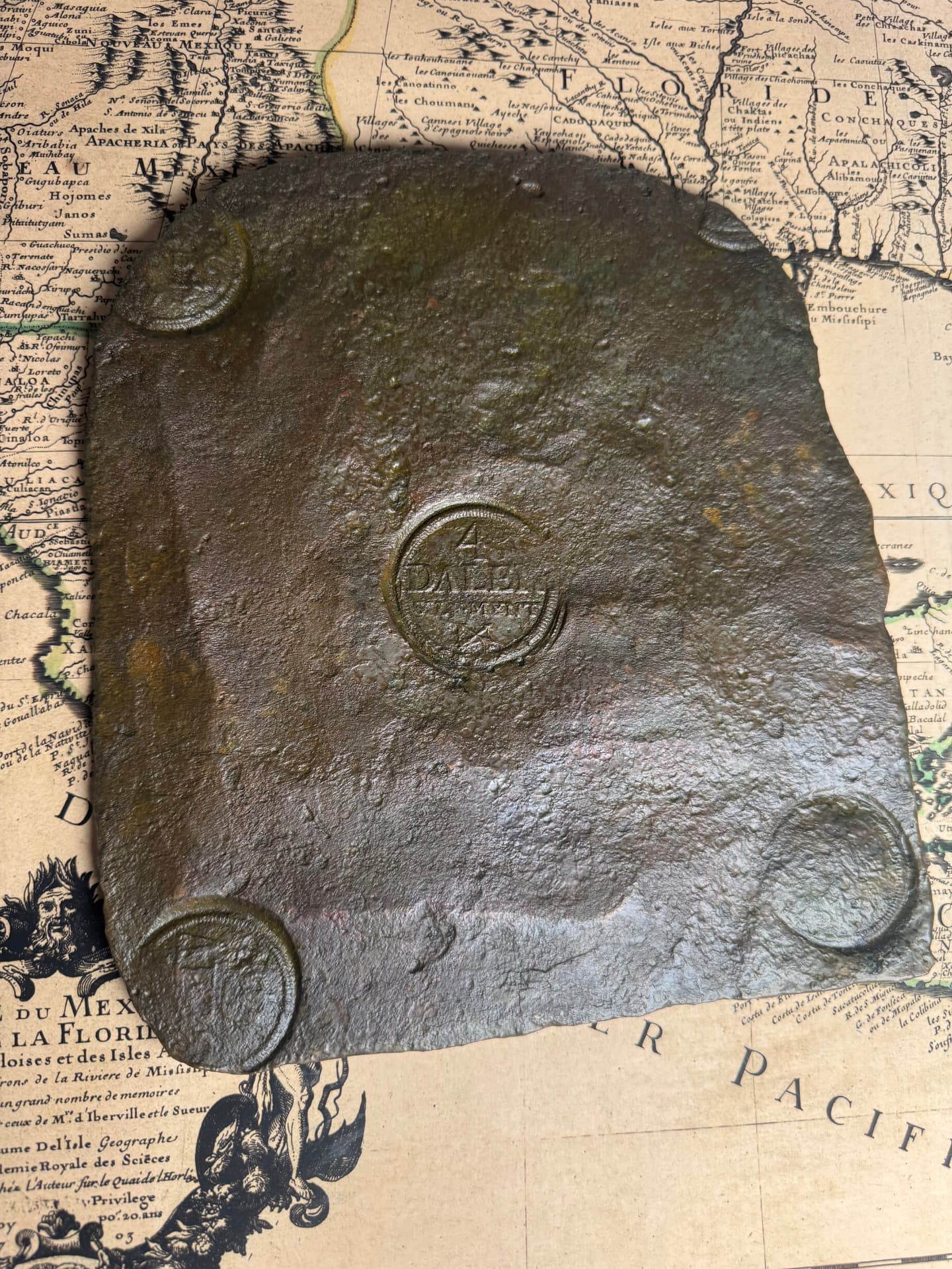 Copper 4 daler Swedish plate money on an antique chart