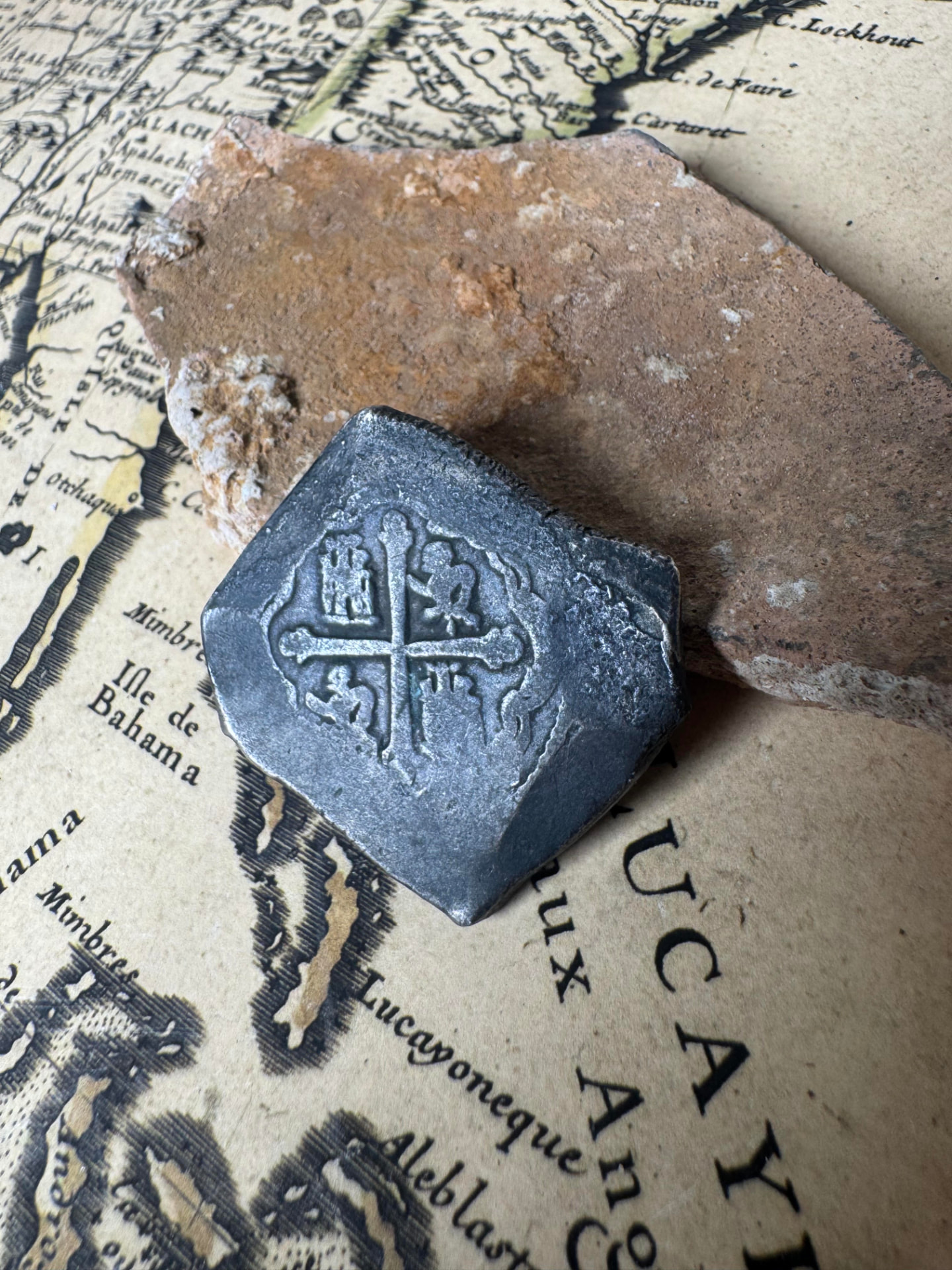 Uncleaned 1715 Fleet Mexico 8 reales cob showing the cross